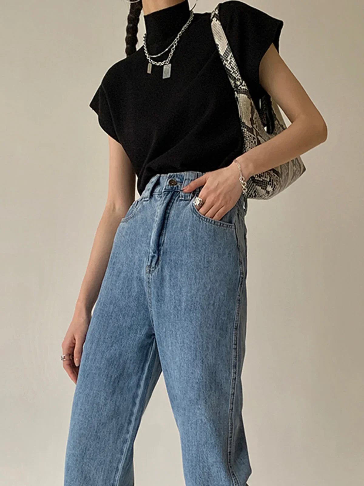 Women's knit padded-shoulder top with mock-neck and cap-sleeves