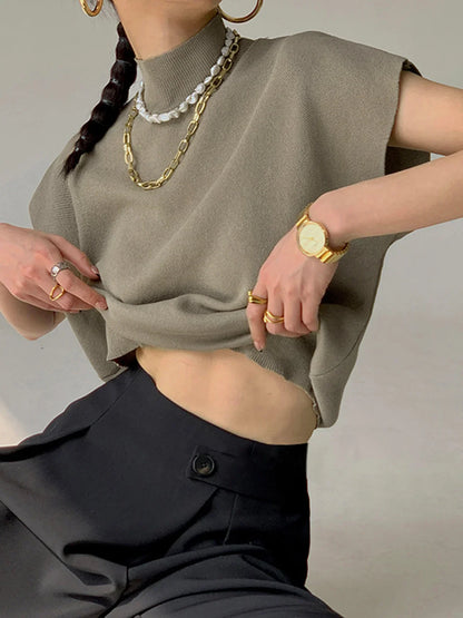 Women's knit padded-shoulder top with mock-neck and cap-sleeves