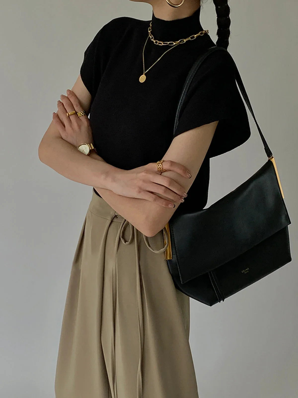 Women's knit padded-shoulder top with mock-neck and cap-sleeves