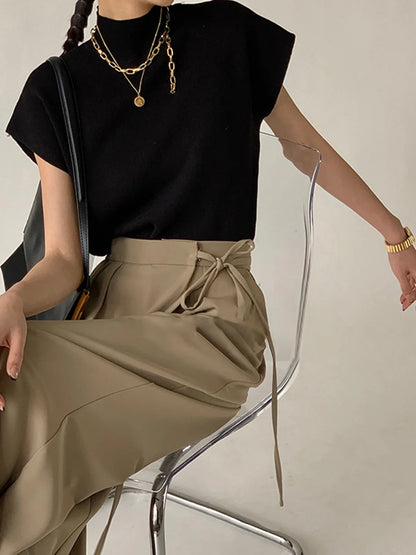 Women's knit padded-shoulder top with mock-neck and cap-sleeves