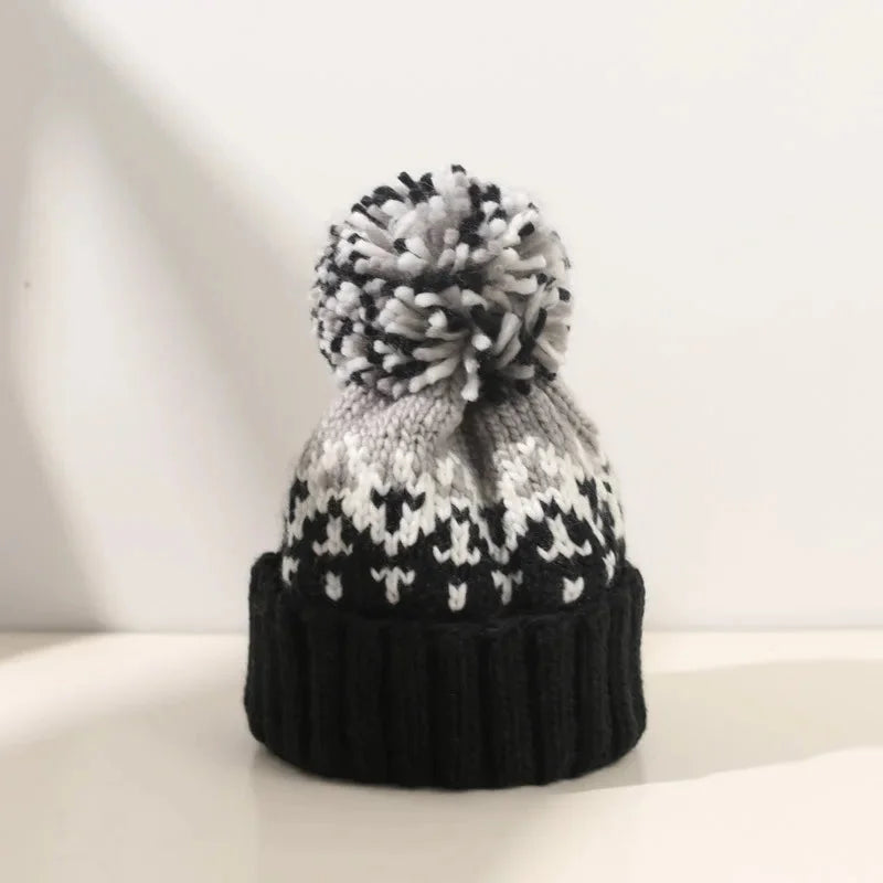 Women's knit snowflake-pattern pom-pom beanie with ribbed cuff – Black