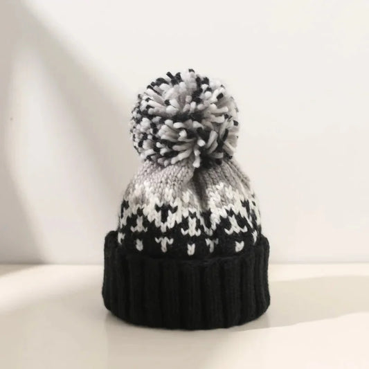 Women's knit snowflake-pattern pom-pom beanie with ribbed cuff – Black
