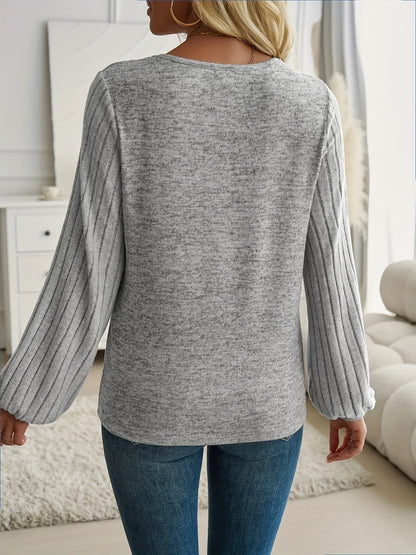 Women's knit sweater with V-neck and ribbed lantern sleeves