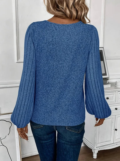 Women's knit sweater with V-neck and ribbed lantern sleeves