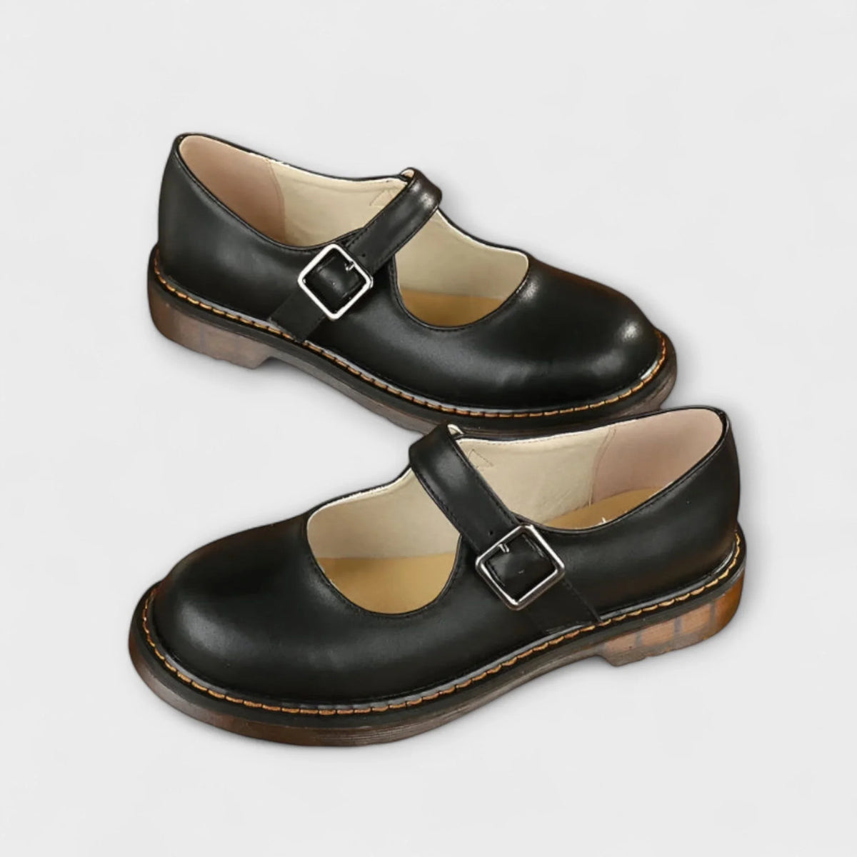 Women's leather Mary Jane shoes with buckle strap and stitched sole