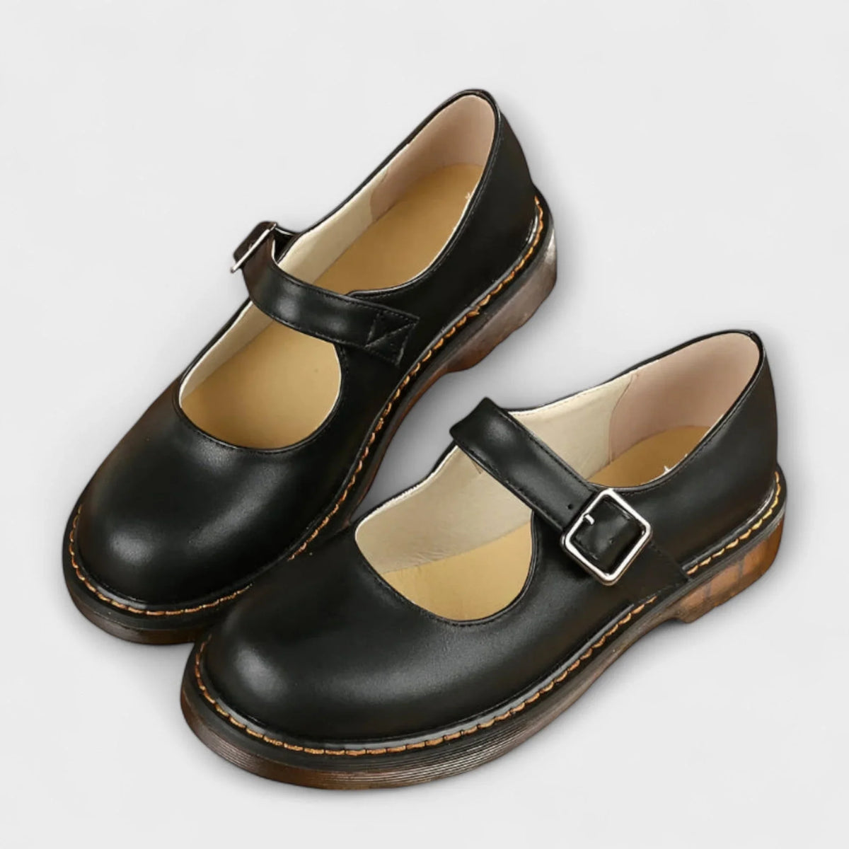 Women's leather Mary Jane shoes with buckle strap and stitched sole