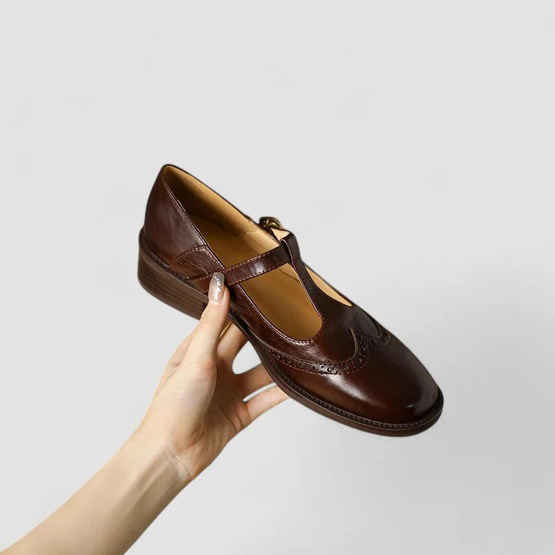 Women's leather Mary-Jane shoes with T-strap buckle and brogue detail
