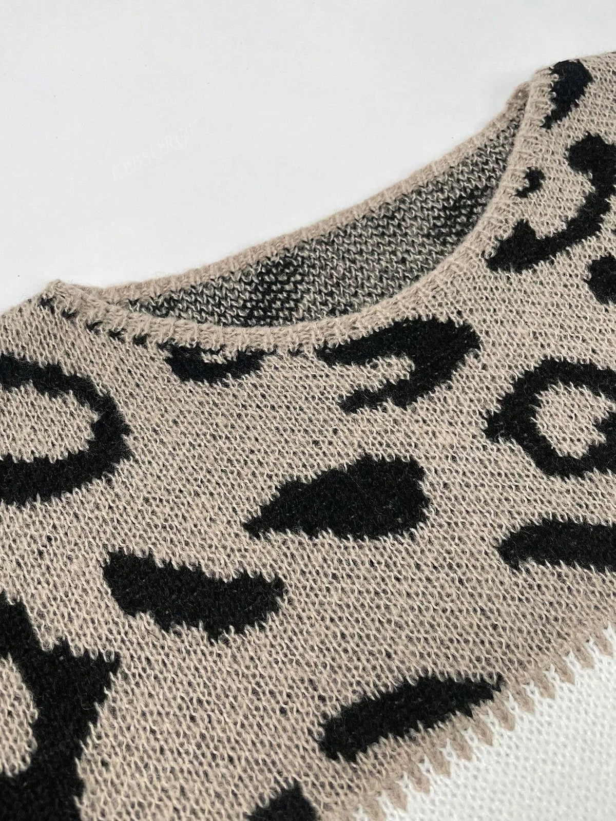 Women's leopard print color-block knit sweater with ribbed cuffs