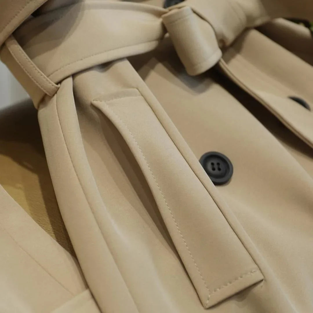 Women's longline belted trench coat with double-breasted closure