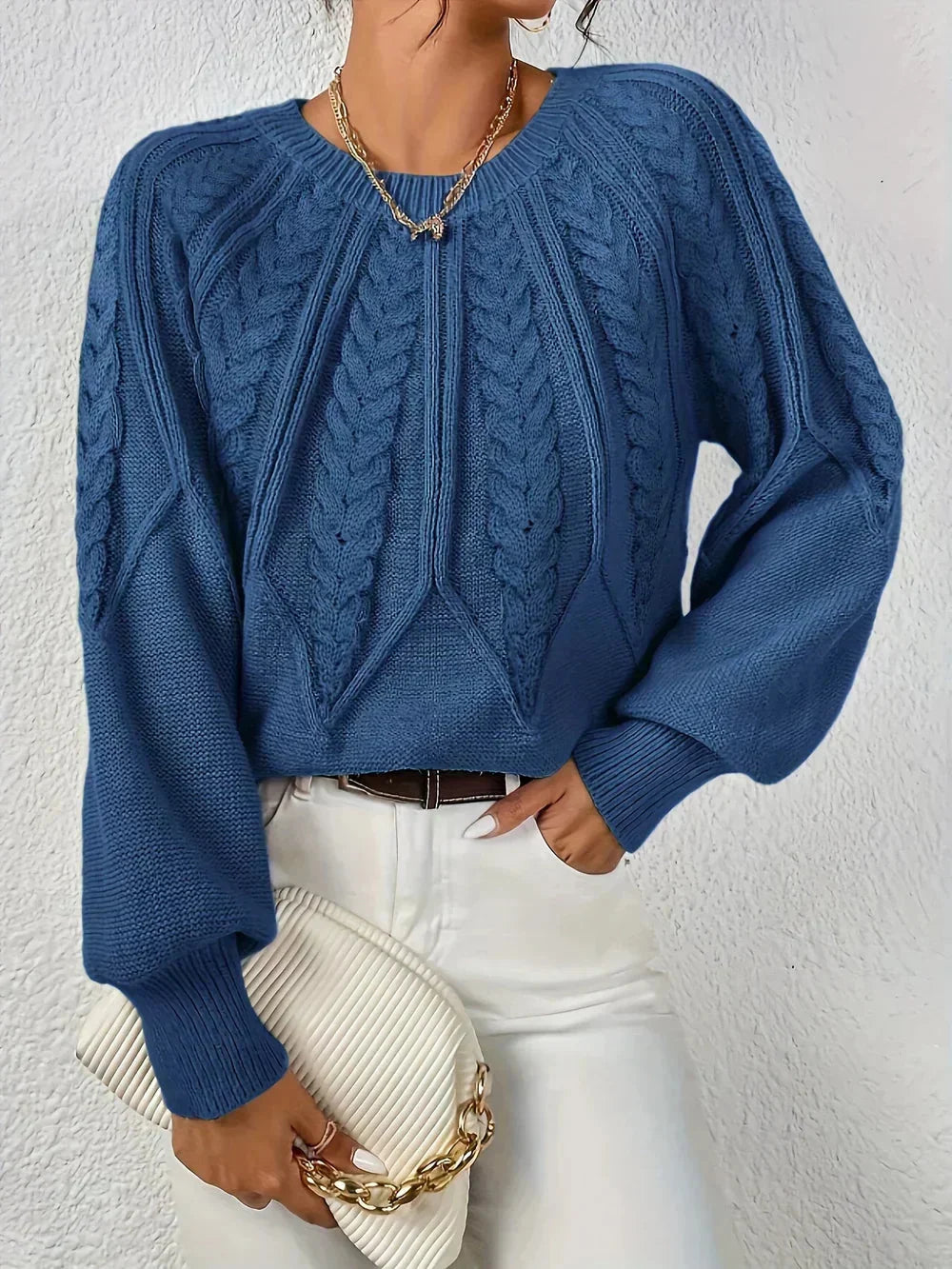 Women's modern cable knit long sleeve knit sweater with crew neck and voluminous sleeves