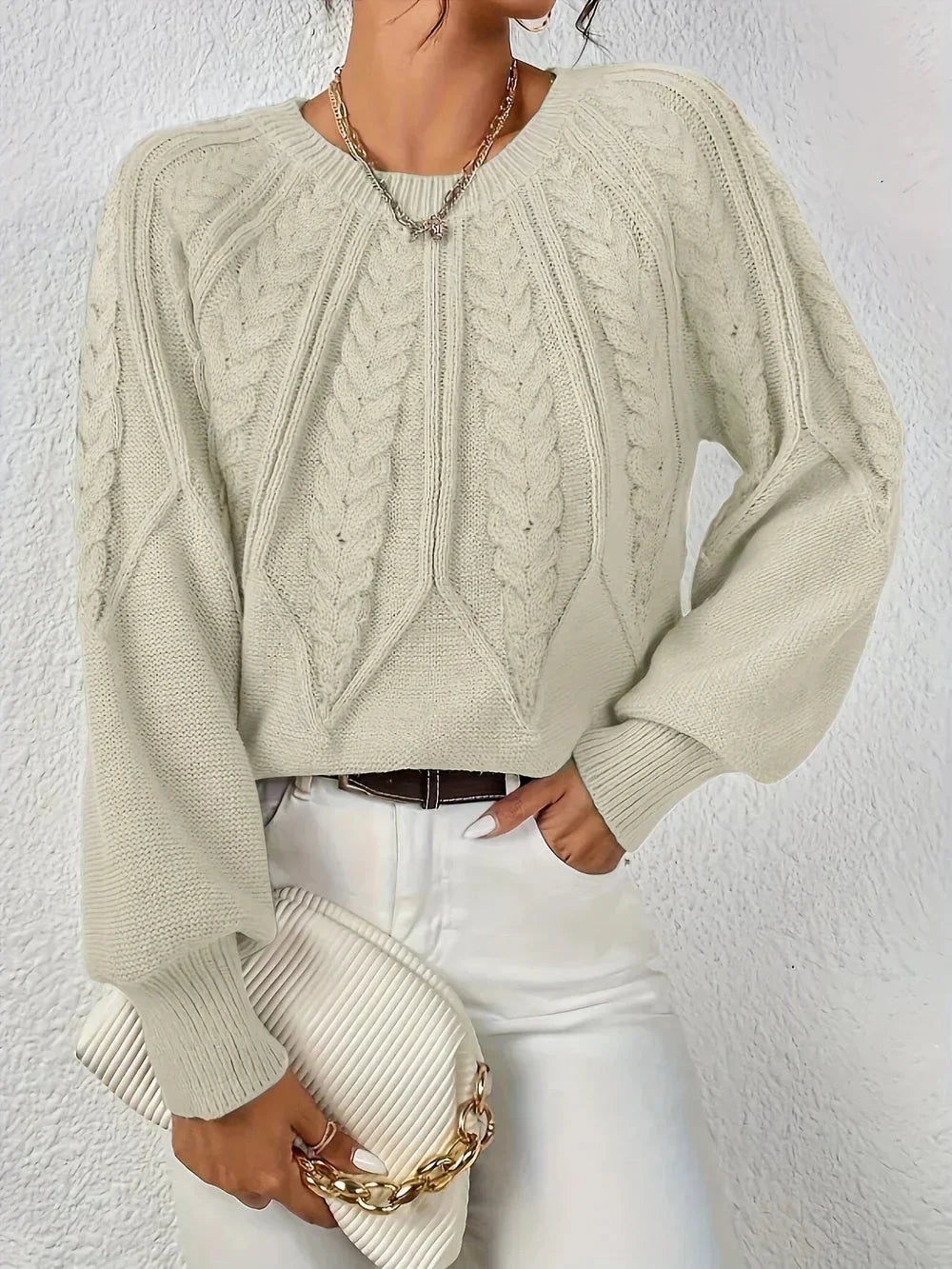 Women's modern cable knit long sleeve knit sweater with crew neck and voluminous sleeves
