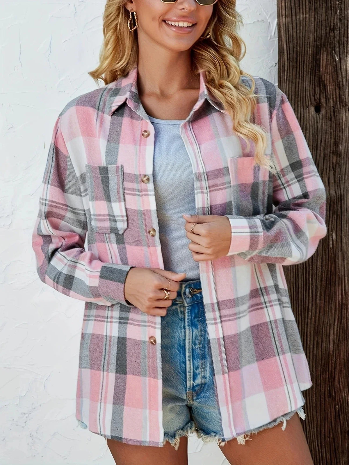 Women's oversized plaid flannel long-sleeve button-down shirt with chest pockets