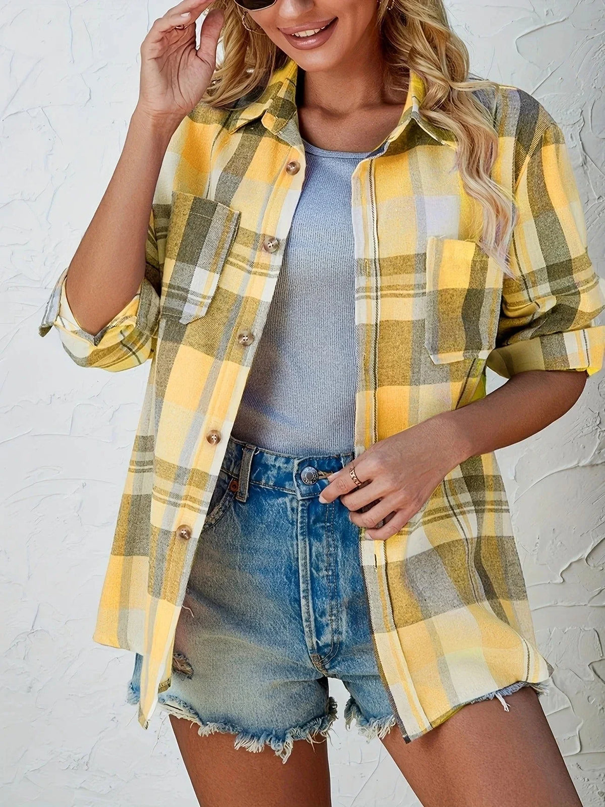 Women's oversized plaid flannel long-sleeve button-down shirt with chest pockets