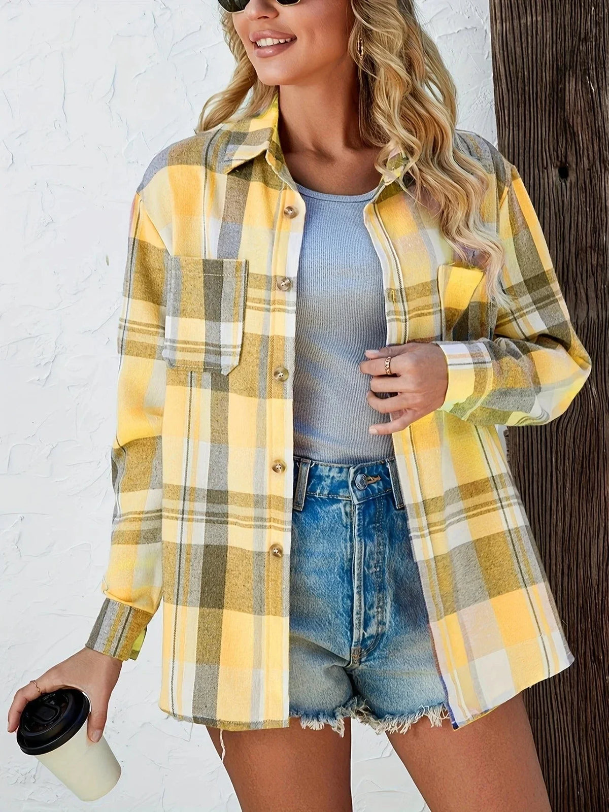Women's oversized plaid flannel long-sleeve button-down shirt with chest pockets