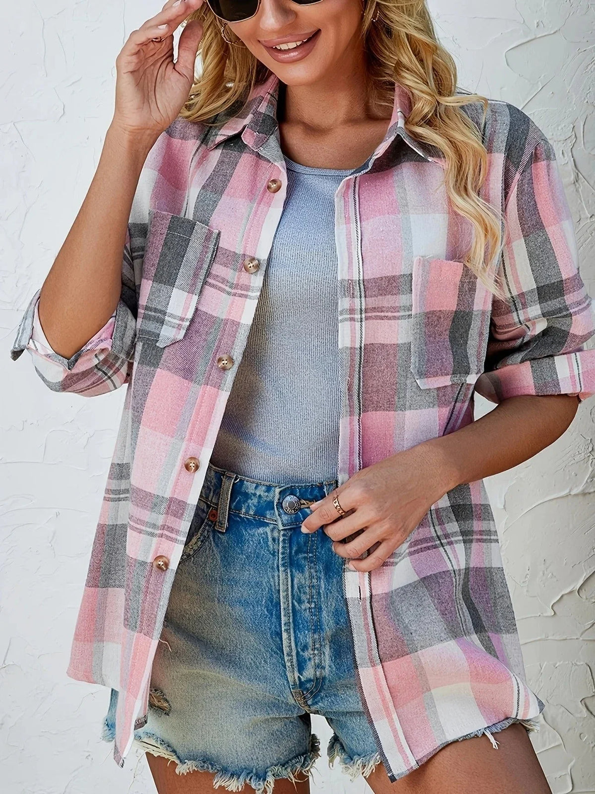 Women's oversized plaid flannel long-sleeve button-down shirt with chest pockets