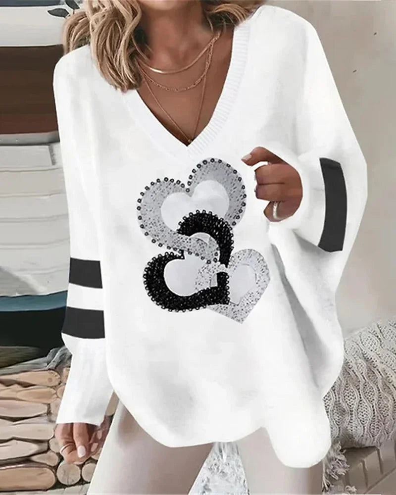 Women's oversized sequin heart print knit sweater with V-neck and striped sleeves – White
