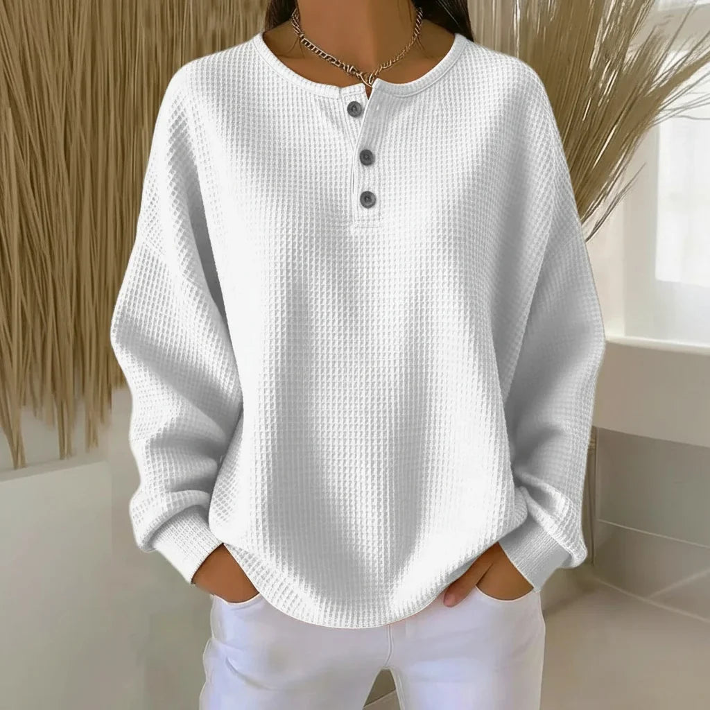 Women's oversized waffle knit sweater with long-sleeve henley design