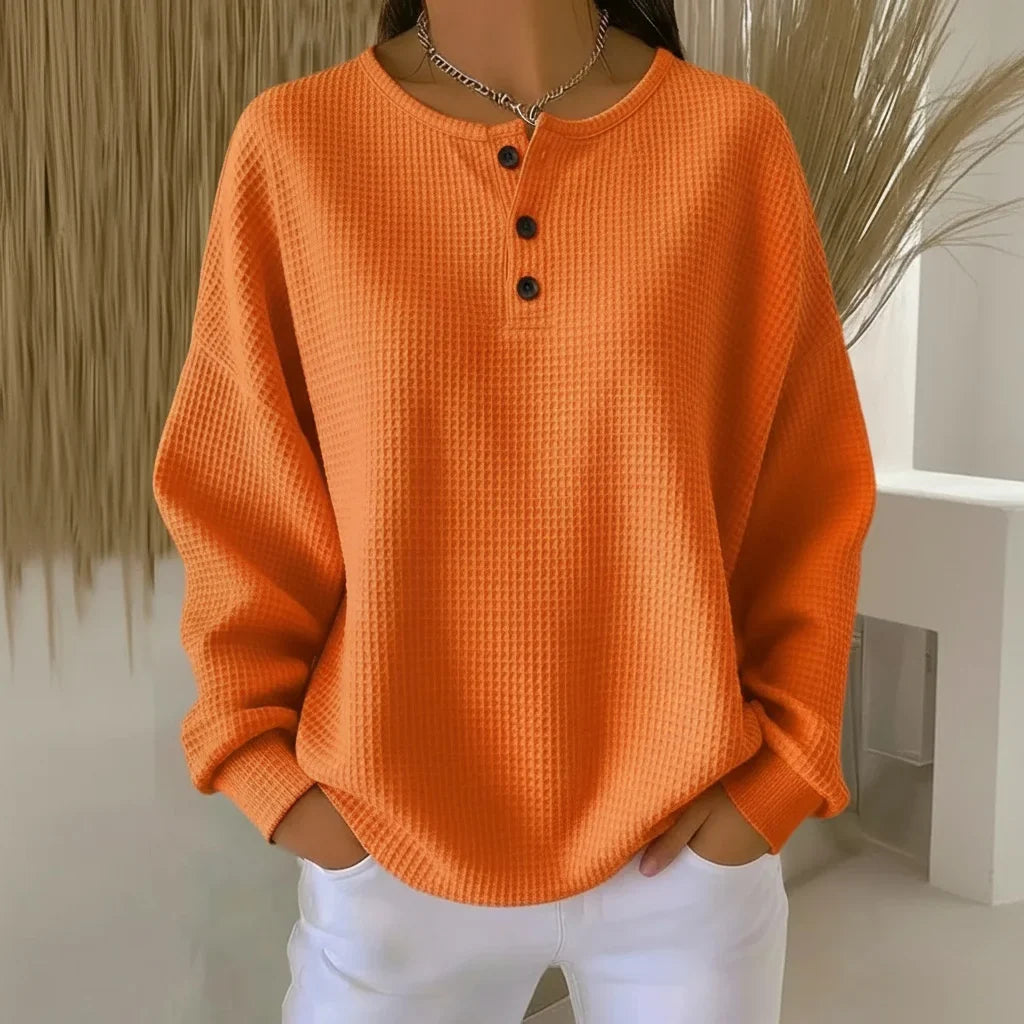 Women's oversized waffle knit sweater with long-sleeve henley design