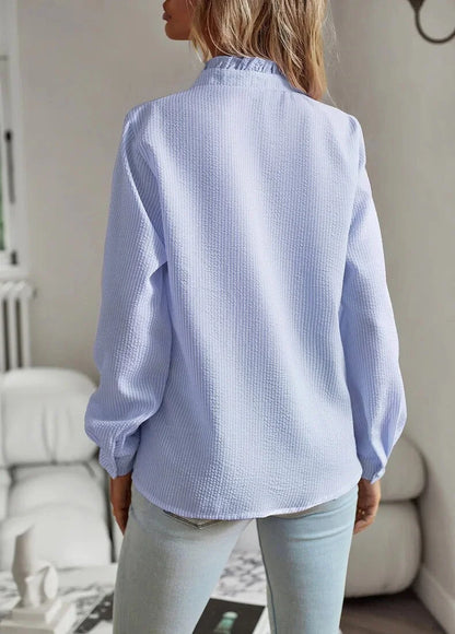 Women's pale textured striped blouse with long sleeves and ruffled stand-collar