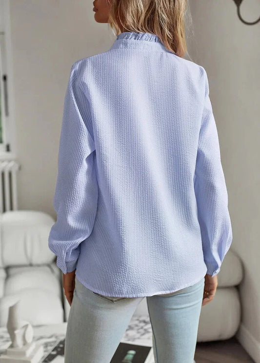 Women's pale textured striped blouse with long sleeves and ruffled stand-collar