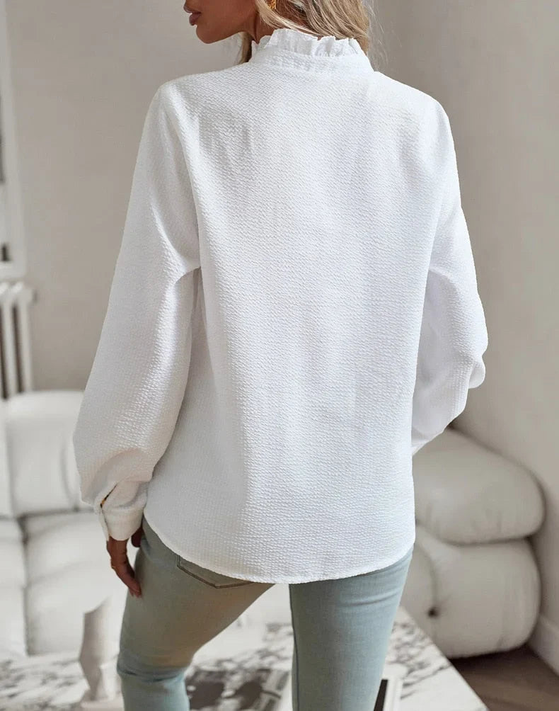 Women's pale textured striped blouse with long sleeves and ruffled stand-collar