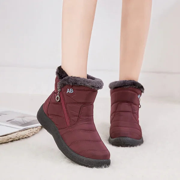 Women's quilted fur-lined winter ankle boots with soft sole and zipper
