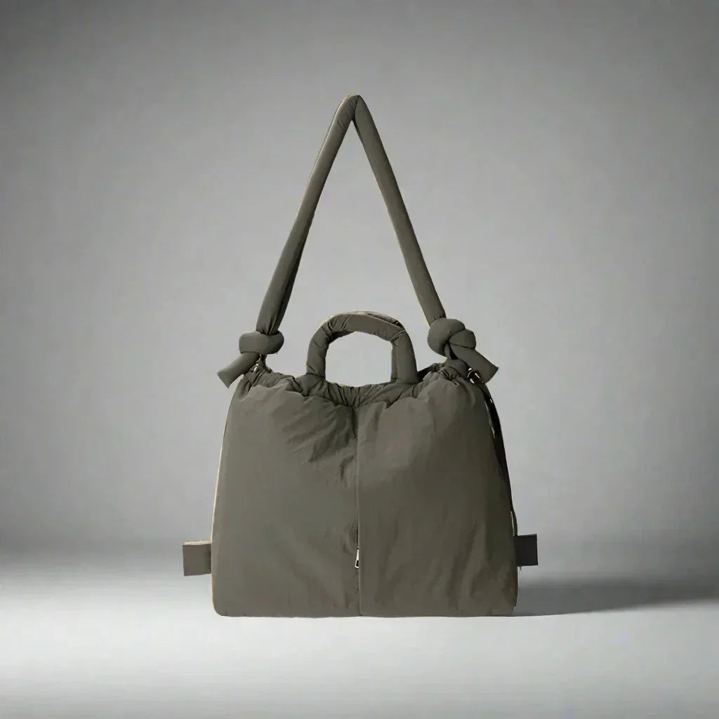 Women's quilted puffer tote bag with drawstring sides and knot-detail strap