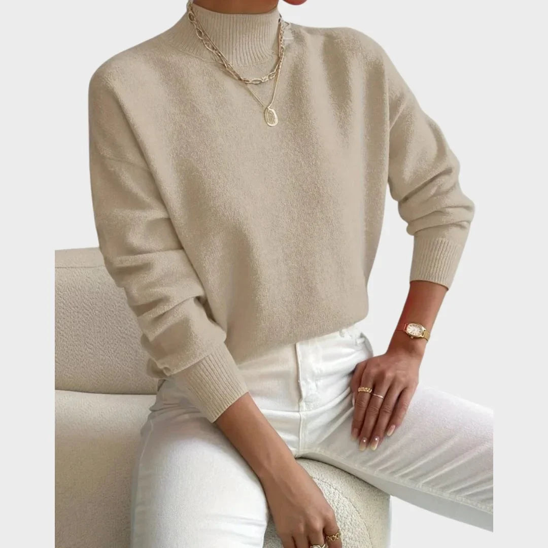 Women's relaxed fit knit sweater with high-neck and ribbed cuffs