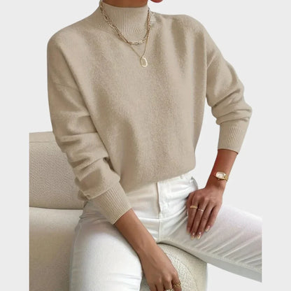 Women's relaxed fit knit sweater with high-neck and ribbed cuffs