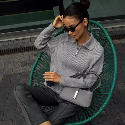 Women's ribbed knit sweater with half-zip polo collar and long raglan sleeves