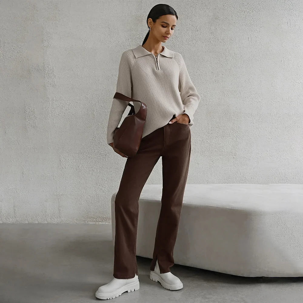 Women's ribbed knit sweater with half-zip polo collar and long raglan sleeves