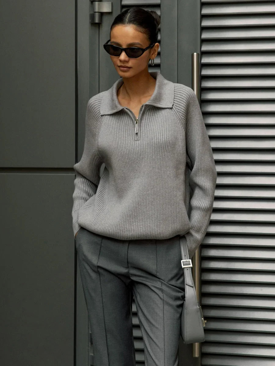 Women's ribbed knit sweater with half-zip polo collar and long raglan sleeves