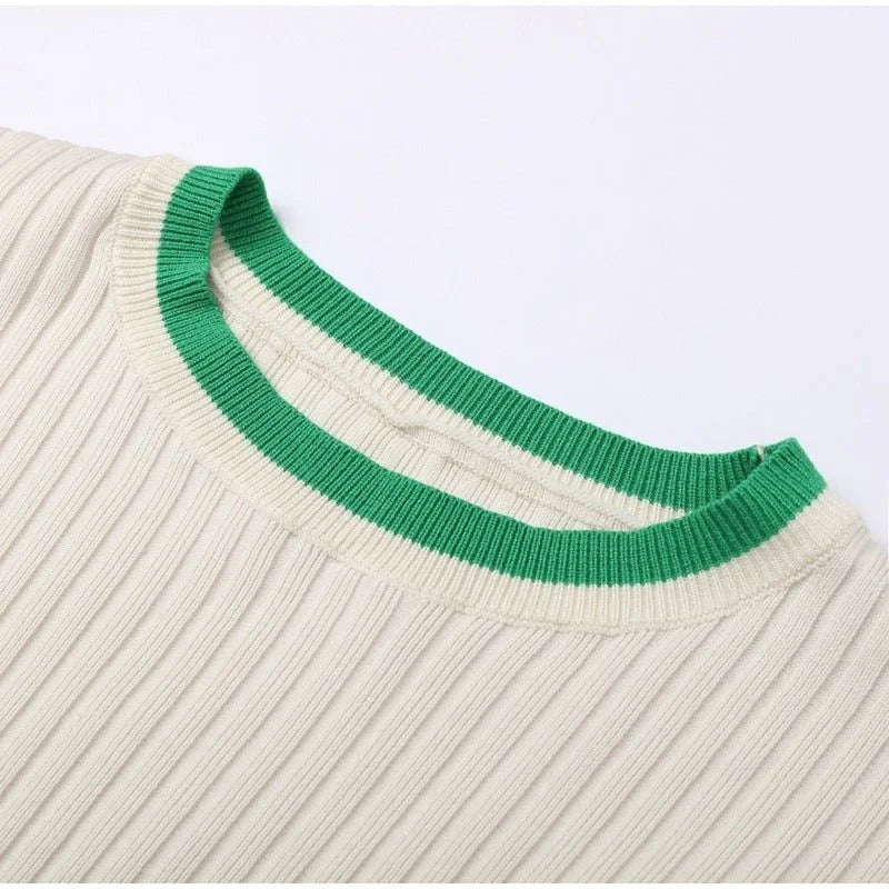 Women's ribbed knit two-piece set with a cropped knit sweater and wide-leg slit trousers