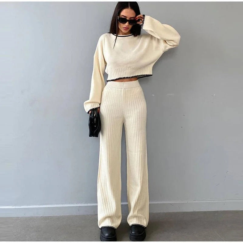 Women's ribbed knit two-piece set with a cropped knit sweater and wide-leg slit trousers