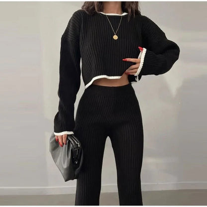 Women's ribbed knit two-piece set with a cropped knit sweater and wide-leg slit trousers
