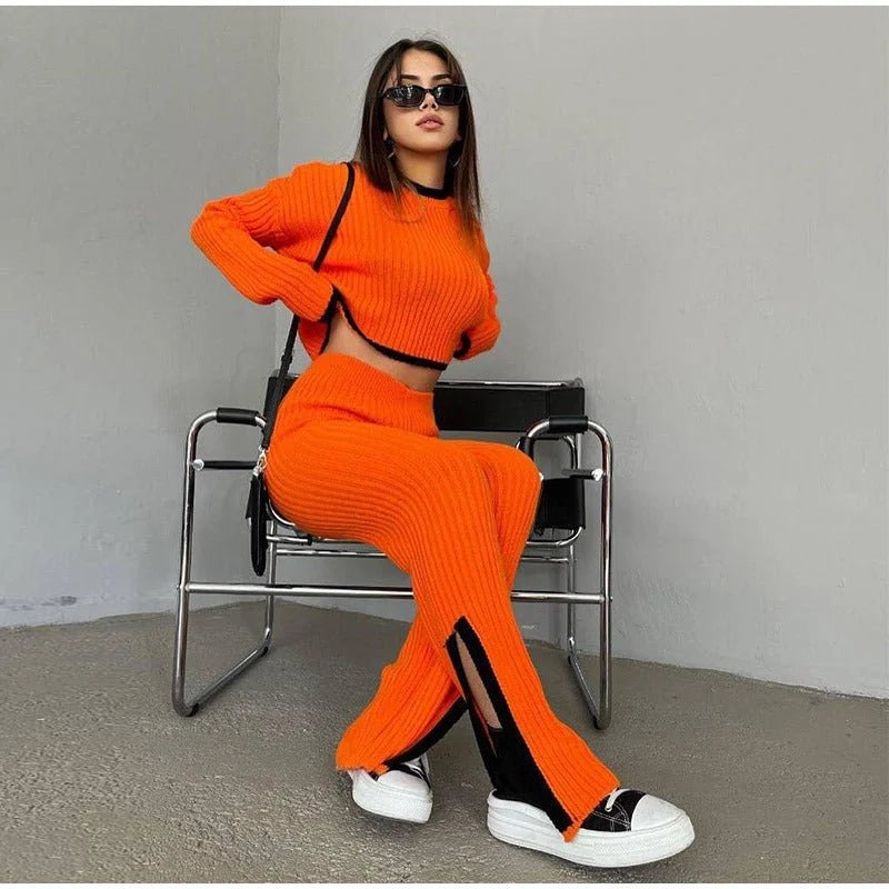 Women's ribbed knit two-piece set with a cropped knit sweater and wide-leg slit trousers