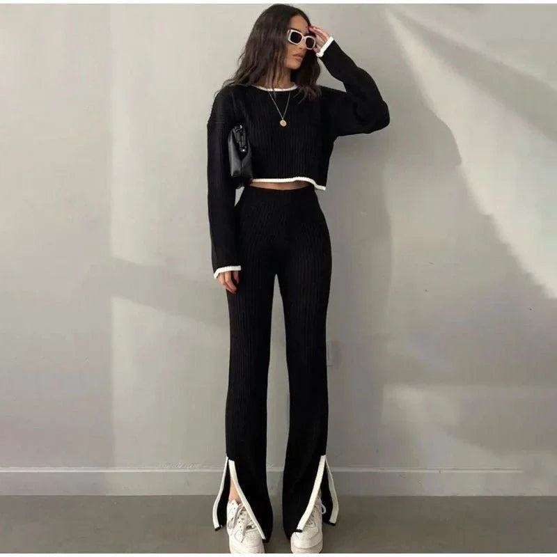 Women's ribbed knit two-piece set with a cropped knit sweater and wide-leg slit trousers