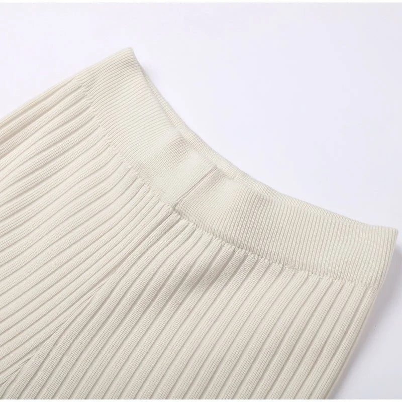 Women's ribbed knit two-piece set with a cropped knit sweater and wide-leg slit trousers
