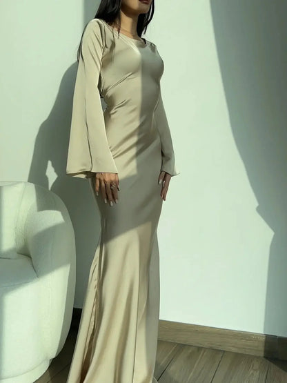 Women's satin fitted long-sleeve maxi dress with scoop neck and flared cuffs