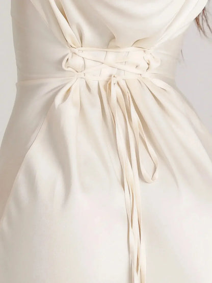 Women's satin fitted long-sleeve maxi dress with scoop neck and flared cuffs