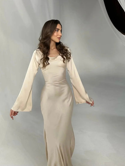 Women's satin fitted long-sleeve maxi dress with scoop neck and flared cuffs