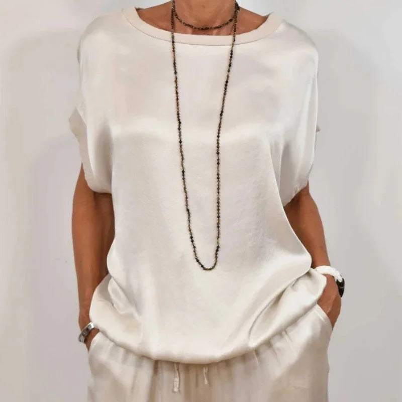 Women's satin matching set with round-neck cap-sleeve top and wide-leg trousers