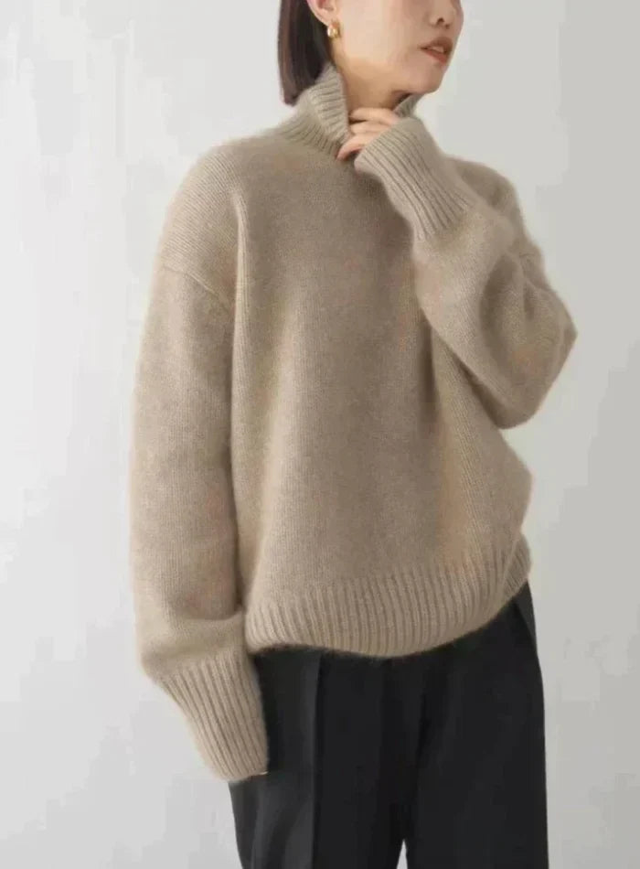 Women's soft turtleneck knit sweater with ribbed cuffs and relaxed fit