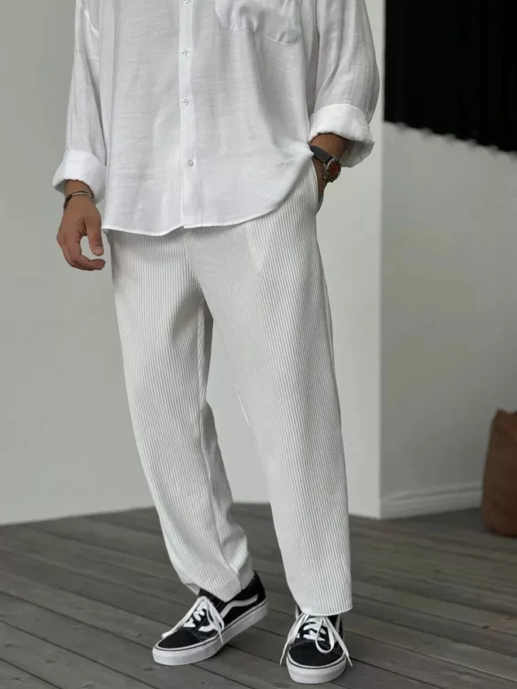 Women's soft pleated relaxed fit trousers with elastic waist and side pockets – White