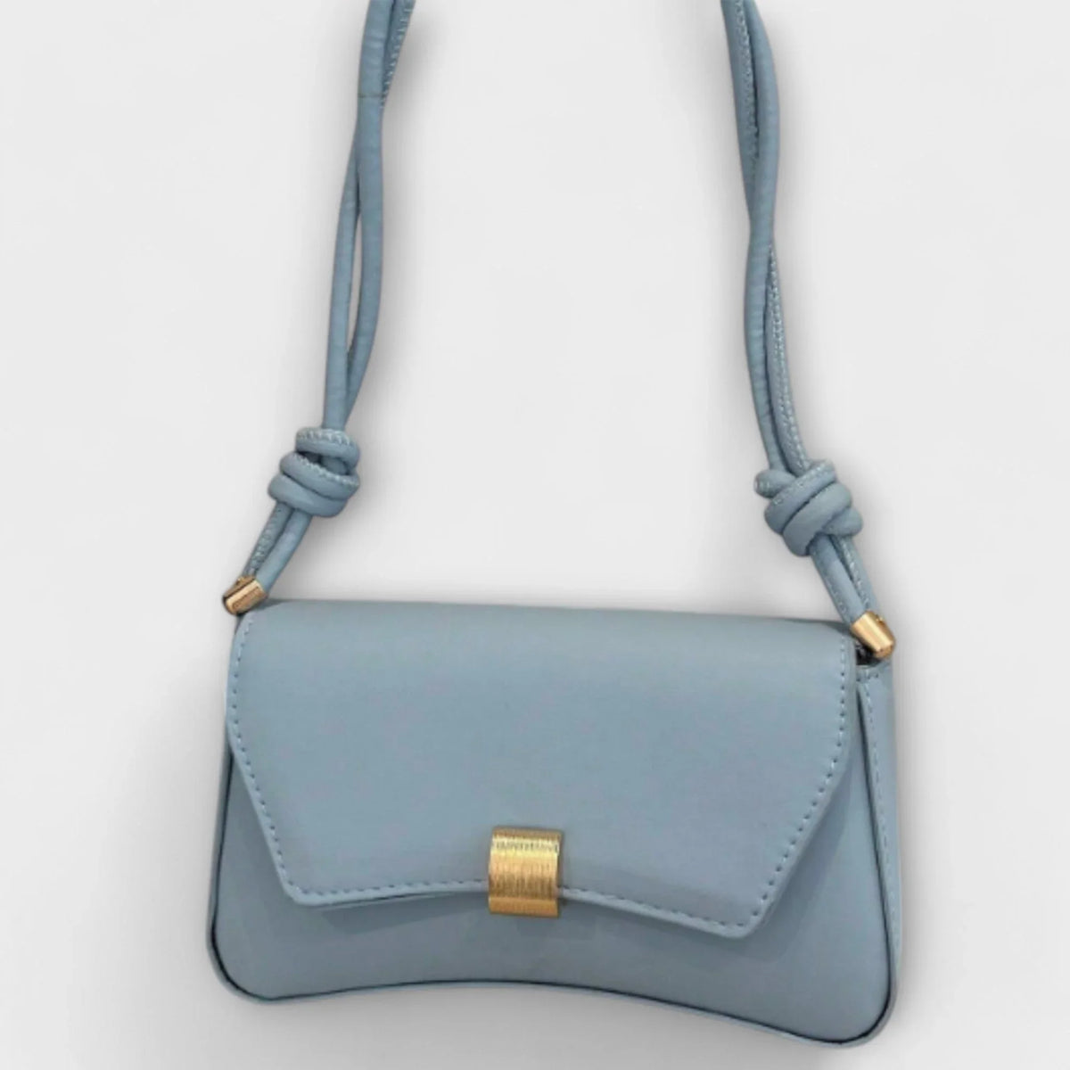 Women's solid color faux leather shoulder bag with flap closure and knotted strap