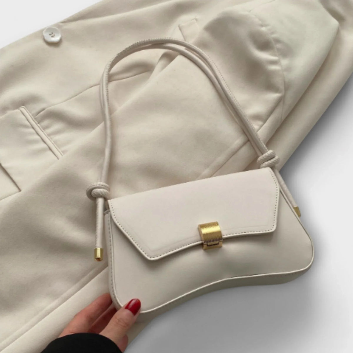 Women's solid color faux leather shoulder bag with flap closure and knotted strap – Beige