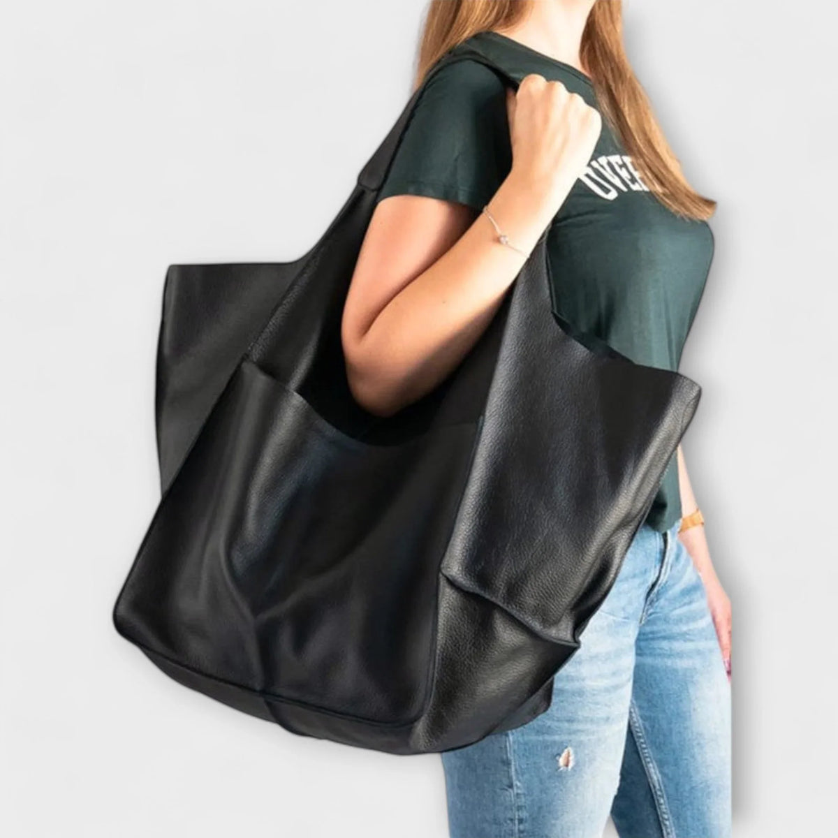 Women's spacious faux leather tote bag with two exterior slip pockets