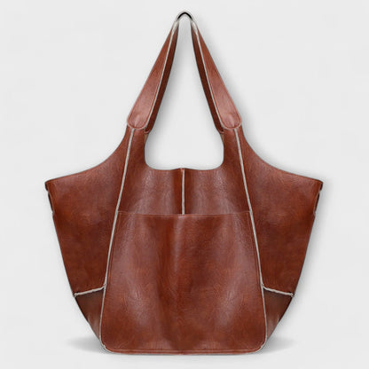 Women's spacious faux leather tote bag with two exterior slip pockets