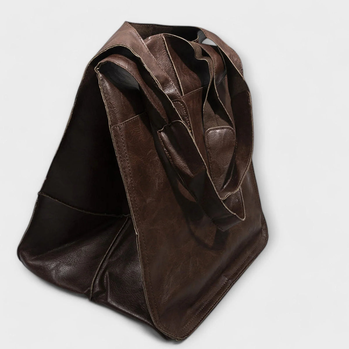 Women's spacious faux leather tote bag with two exterior slip pockets