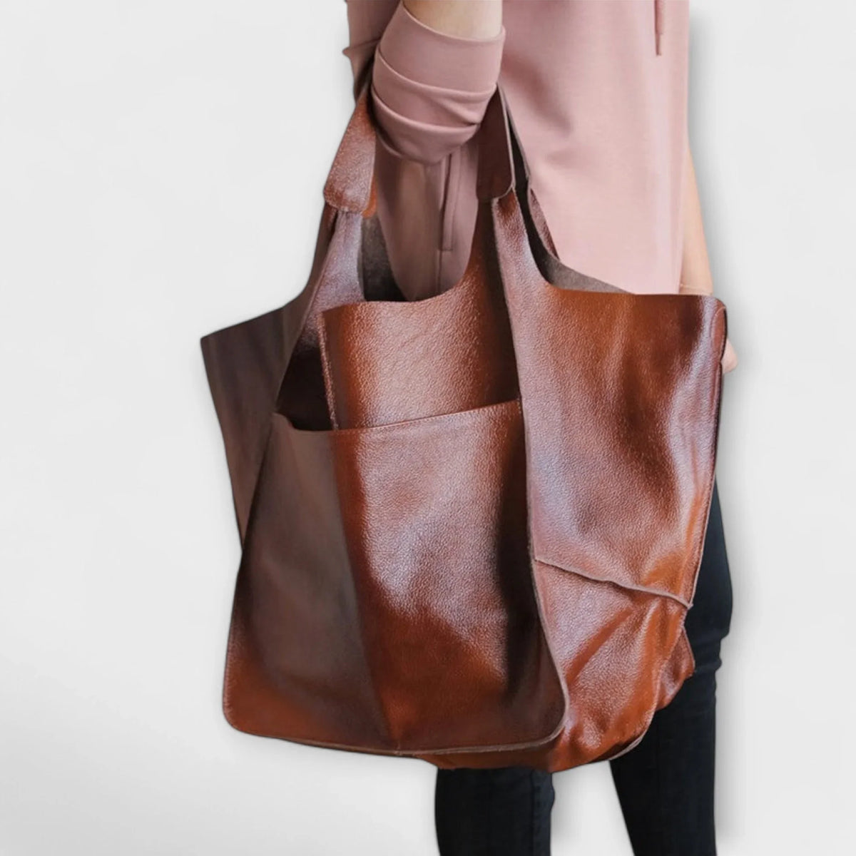 Women's spacious faux leather tote bag with two exterior slip pockets